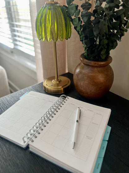 the year - a navy, spiral Orthodox undated life planner with four tabs of resources for organizing your days, keeping your faith close, maintaining your home and knowing where your finances stand - all at your fingertips.

