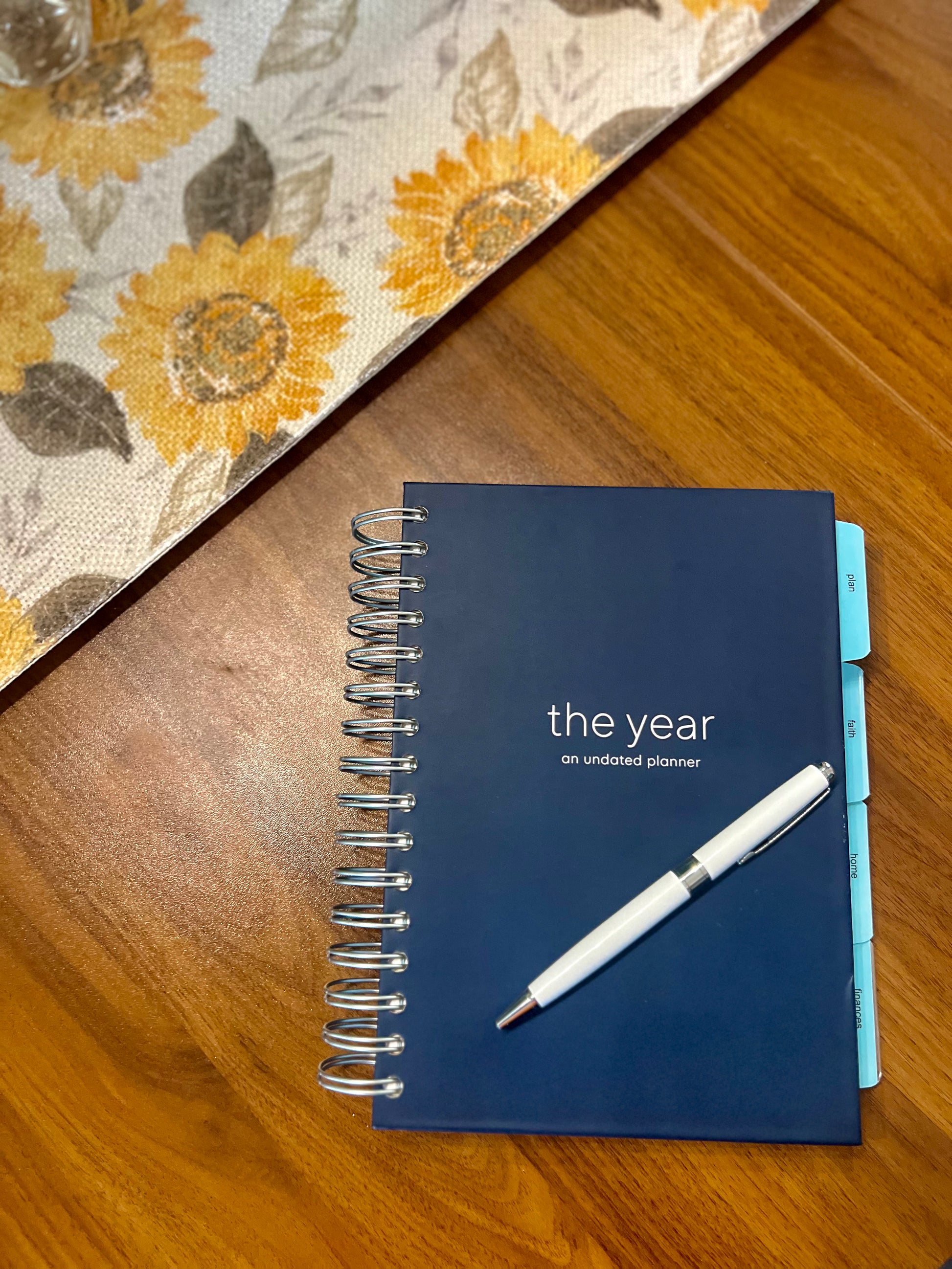 the year - a navy, spiral Orthodox undated life planner with four tabs of resources for organizing your days, keeping your faith close, maintaining your home and knowing where your finances stand - all at your fingertips.